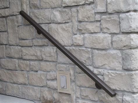 installing metal brackets on a masonry wall|concrete handrail bracket mount.